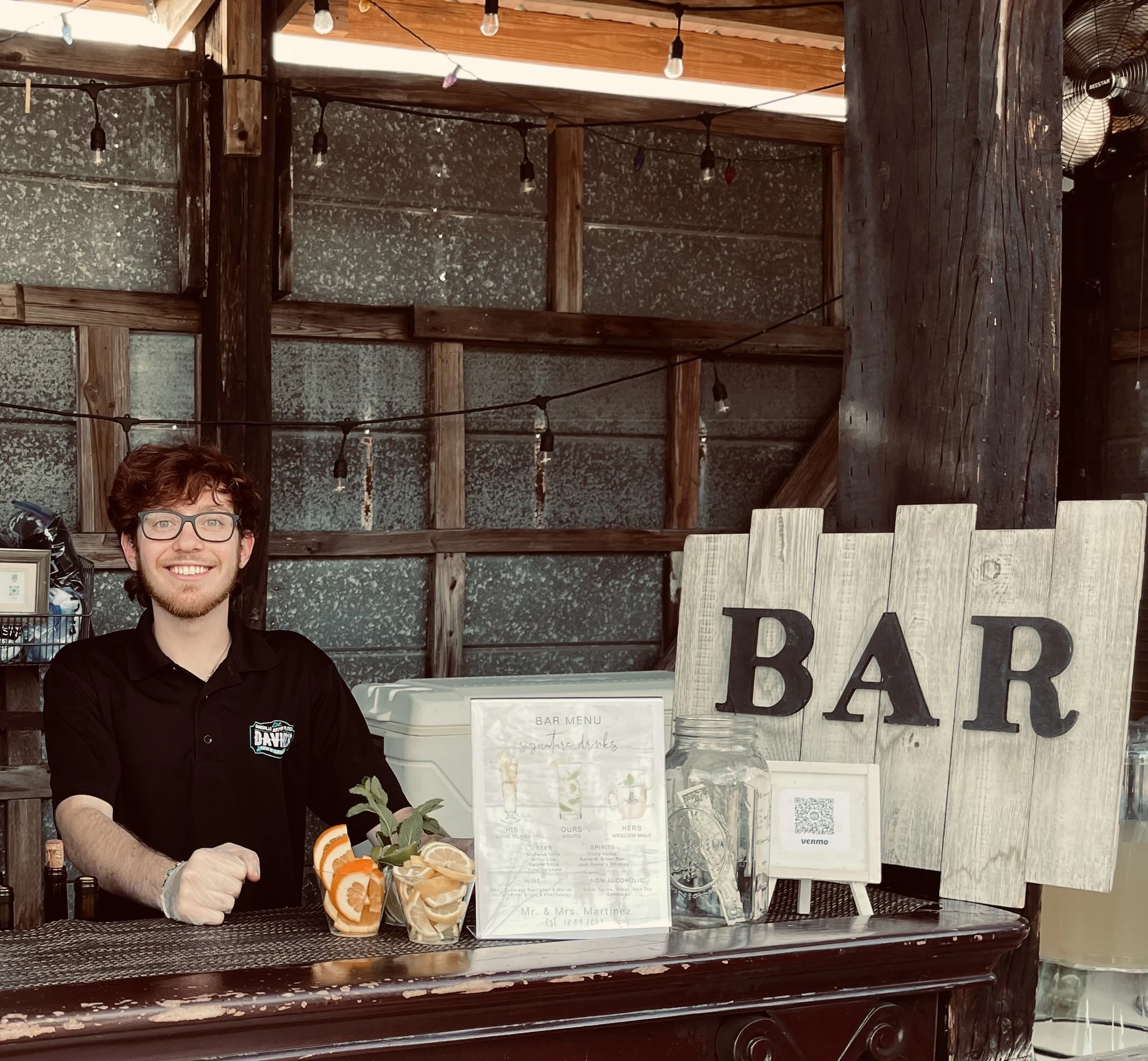 A full service bar staffed and ready for a wedding reception.